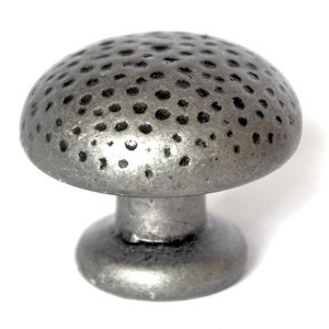 May include: A silver-toned cabinet knob with a textured, hammered finish. The knob has a round top and a smaller, round base.