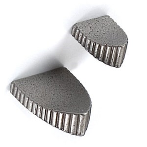 May include: Two small, grey, triangular shelves with a textured surface and a scalloped edge.