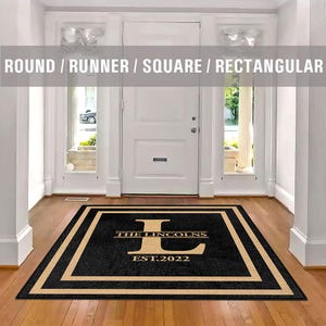 May include: Black doormat with a tan border and the text "The Lincolns Est. 2022" with a large "L" in the centre.