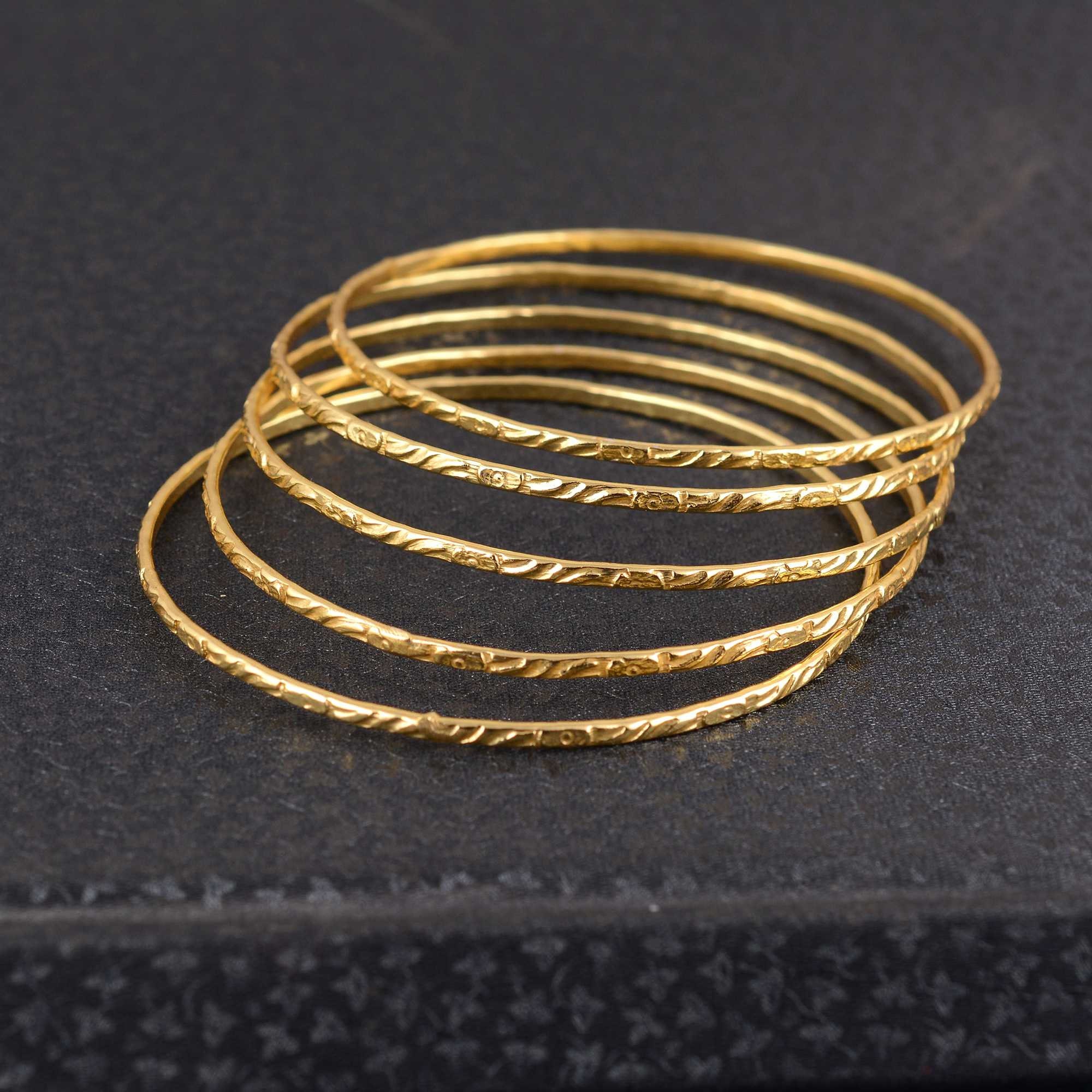 Gold slim bangle designs sale