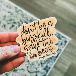 May include: Yellow and white striped sticker with the text "Don't be a buzzkill, save the bees" and a small bee illustration. The sticker has the text "burdsy brothers honey" at the bottom.