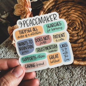 May include: A colorful sticker with the text "9. Peacemaker" and a list of qualities associated with peacemakers, such as "They see all sides of a situation", "Wants to maintain peace", "Trustworthy human", and "Great listener".