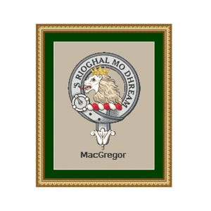 May include: Framed heraldic crest of the MacGregor clan. The crest features a lion's head with a crown, surrounded by a circular inscription. The frame is gold with a green border, and the name "MacGregor" is printed at the bottom.