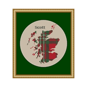 May include: Framed cross-stitch artwork featuring a map of Scotland with a red, green, and white plaid pattern. The name "Scott" is stitched above the map. The artwork is set against a dark green background within a gold-colored frame.