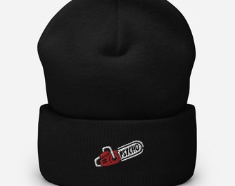 May include: Black beanie with a white embroidered chainsaw and the word "PSYCHO" in red.