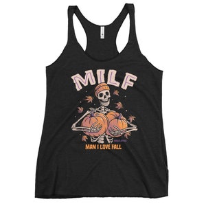 May include: Black tank top with a skeleton holding two pumpkins and the text "MILF MAN I LOVE FALL".