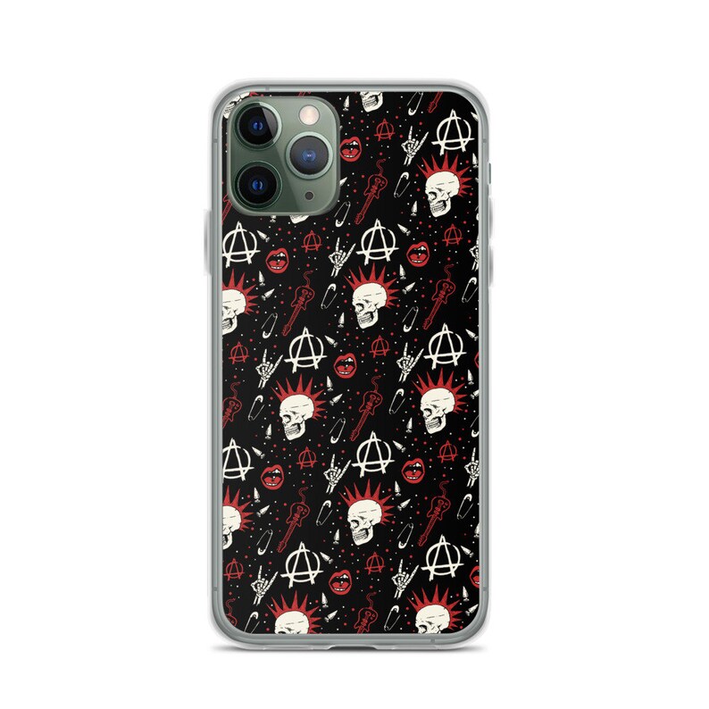 May include: A clear phone case with a black background and a repeating pattern of red and white punk rock symbols, including skulls, safety pins, anarchy symbols, and guitars.
