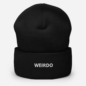 May include: Black beanie with a white embroidered word "WEIRDO" on the cuff.