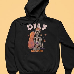 May include: Black hoodie with a skeleton holding a pumpkin and a cup. The text "DILF DUDE I LOVE FALL" is printed on the hoodie.