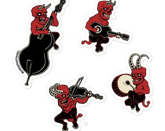May include: Four red devil stickers with horns, playing musical instruments. One plays a bass, one plays a guitar, one plays a violin, and one plays a drum.