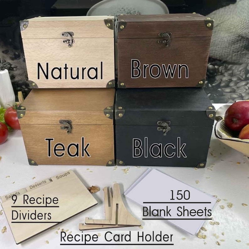 May include: Four wooden recipe boxes in natural, brown, teak, and black finishes. The boxes are closed and have a metal latch. The boxes are arranged in two rows of two. Below the boxes are 9 wooden recipe dividers, a wooden recipe card holder, and a stack of 150 blank recipe cards. The text "9 Recipe Dividers" and "150 Blank Sheets" is visible in the image.