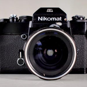 Near Mint Black Nikon EL 35mm SLR Film Camera + Nikon 35mm f2.8 Lens + Original Nikon Strap + Battery + Soft Shutter Button -  Film Tested