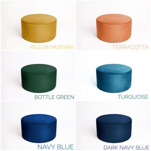 May include: Five round velvet ottomans in different colors: yellow mustard, terracotta, bottle green, turquoise, and navy blue.