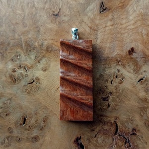 Carved Wood Pendant, made from Leopard wood, silver