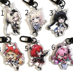 May include: Collection of six anime-style acrylic keychains featuring various characters. Each keychain has a different character design, with varying hair colors and outfits. The keychains are attached to black metal clasps.
