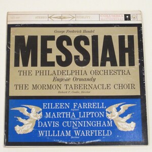 May include: A vintage vinyl record cover for George Frederick Handel's Messiah, featuring a gold background with black text. The cover features the names of the performers: The Philadelphia Orchestra, Eugene Ormandy, The Mormon Tabernacle Choir, and the soloists Eileen Farrell, Martha Lipton, Davis Cunningham, and William Warfield.