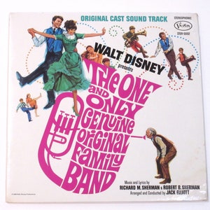 May include: A vintage vinyl record album cover featuring a pink trombone with the text "The One and Only Genuine Original Family Band" in a colorful, stylized font. The cover also features a couple dancing and a group of musicians.