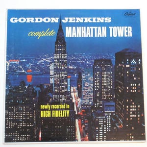 May include: Vintage vinyl record album cover for "Manhattan Tower" by Gordon Jenkins. The cover features a nighttime cityscape with a prominent skyscraper and the text "complete Manhattan Tower" and "High Fidelity".