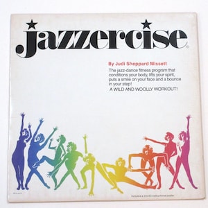 May include: A vintage "Jazzercise" fitness program cover. The white cover features the word "Jazzercise" in large black letters with a star above the "J". Below the title is text by Judi Sheppard Missett. Colorful silhouettes of people dancing are at the bottom.