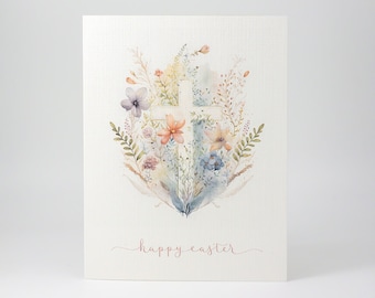 May include: A white cross surrounded by watercolour flowers in shades of blue, pink, orange, and yellow. The text "happy easter" is written in cursive below the cross.
