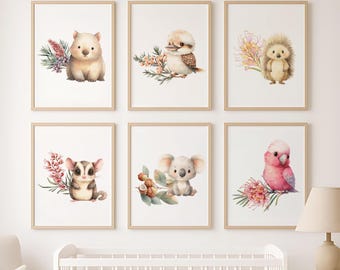May include: Six framed watercolor prints featuring adorable Australian animals: a wombat, kookaburra, hedgehog, sugar glider, koala, and a pink galah. Each animal is accompanied by floral and botanical elements, creating a charming nursery or children's room decor.
