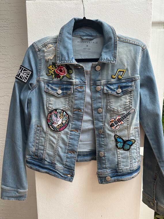 Distressed denim jacket with patches outlet