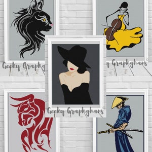 May include: Five different digital art prints featuring a black cat, a woman in a hat, a woman playing the cello, a red bull, and a samurai. Each print has a grey background and the text "Geeky Graphghans" at the bottom.