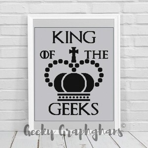 May include: Black and white graphic design with the text "King of the Geeks" and a crown with a cross on top.