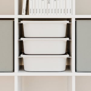 Ikea Kallax insert “Schuuver” rail system with Trofast boxes in different colors ideal for storing toys