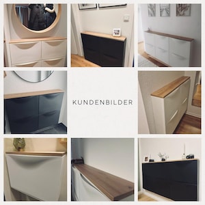 May include: A set of six shoe storage cabinets with a wooden top. The cabinets are in two different colours: white and black. The cabinets are mounted on a wall. The text "KUNDENBILDER" is displayed in the centre of the image.