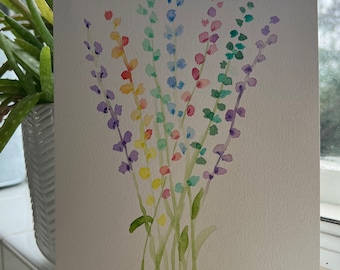 May include: Watercolor painting of a bouquet of colorful flowers. The flowers are painted in shades of purple, blue, green, yellow, orange, and red. The stems are green, and the background is a light cream color. The artwork is signed in the bottom right corner.