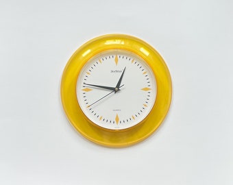 Retro Yellow SkyTimer Wall Clock Transparent Plastic Frame & Numberless Dial Battery Powered