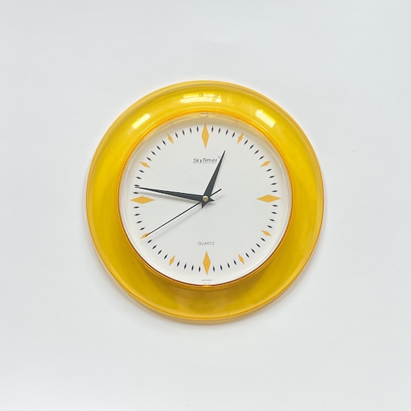 Retro Yellow SkyTimer Wall Clock Transparent Plastic Frame & Numberless Dial Battery Powered