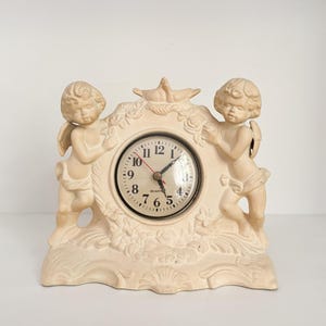 Vtg Porcelain Neoclassical Mantle Clock High Relief Cherub, Bird, & Flower Frame