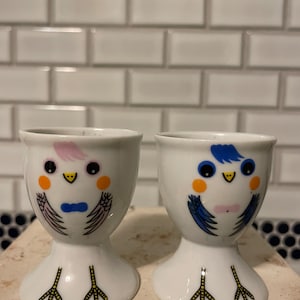 A pair of single cups, porcelain, kitschy cartoon bird faces, farmhouse decor, country kitchen,  holiday brunch