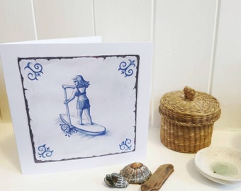 Paddleboard; SUP; summer at the seaside greetings card; blue and white; handdrawn design' in the style of an antique delft tile