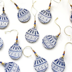 Blue and white handmade ceramic Christmas bauble decoration with beads; nordic; rustic; hugge; scandinavian style; winter
