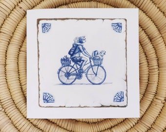 Cyclist with dogs greetings card / notelet; dog in bicycle basket and rucksac; cheerful and sweet; handdrawn design in style of delft tile.