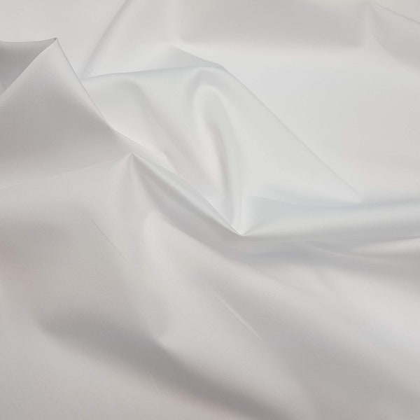 Pure cotton wrinkle free, natural stretch, stain resistant shirting fabric. White and light blue. Swiss made