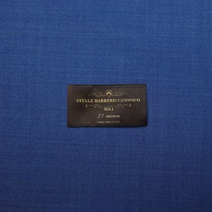 May include: A brown fabric label with gold text that reads "Vitale Barberis Canonico 1663 21 micror. Fabric Made in Italy".