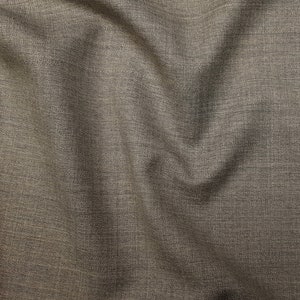May include: Close-up of a brown fabric with a subtle woven texture. The fabric has a slightly rough feel and a slightly shiny appearance.