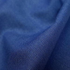 Rustic tropical 21 micron wool fabric by Vitale Barberis Canonico in blue and brown tan colors.