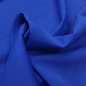 Royal blue suiting stretch fabric. Wool blend.  Used for sewing cabin crew uniform. Made in Italy.
