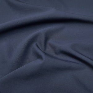 Washable merino wool fabric for suits and pants. Navy blue color. Pure merino wool super 120&#39;S, high performance fabric, made by Reda(Italy)