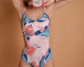 Woman one-piece swimsuit with desined drawing flowers and birds, nude colour and open back tied up leotard with cups