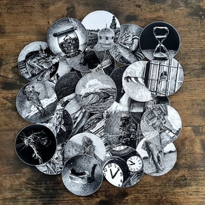 May include: A collection of black and white circular stickers featuring detailed illustrations. The images include an hourglass, a well, a clock, an elephant, and other surreal scenes. The stickers are arranged on a wooden surface.