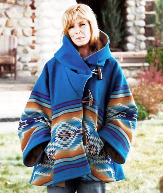 beth's blue poncho on yellowstone