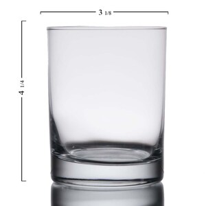 May include: A clear glass tumbler with a rounded bottom. The tumbler is 4 1/4 inches tall and 3 1/8 inches wide.