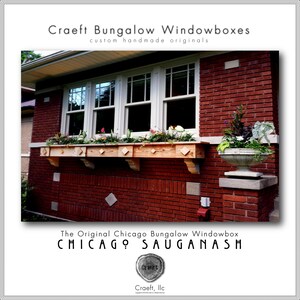 May include: A wooden window box with plants in it, mounted on a brick wall. The window box is labeled "The Original Chicago Bungalow Windowbox CHICAGO SAUGANASH".