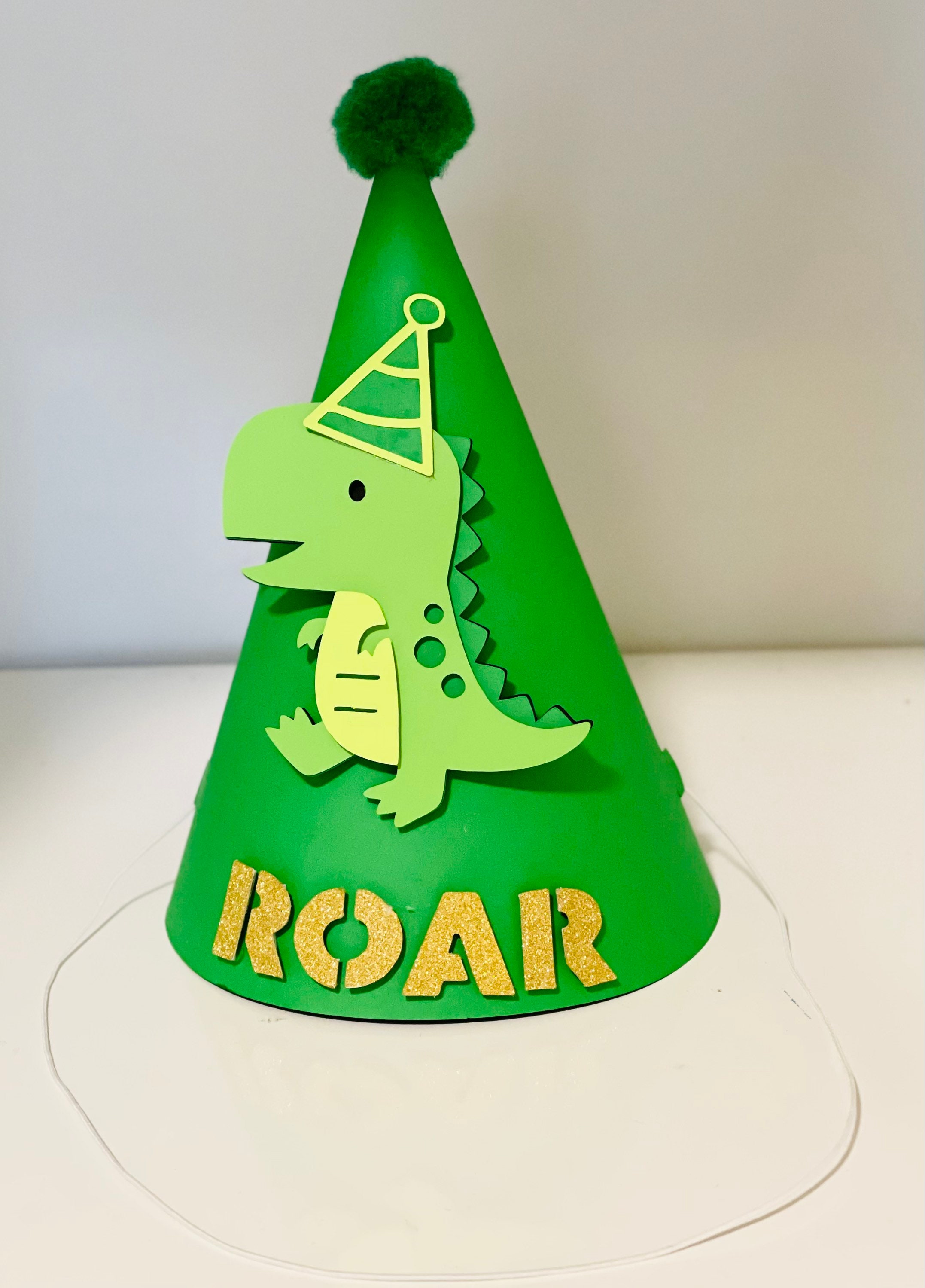 dinosaur with cone on head